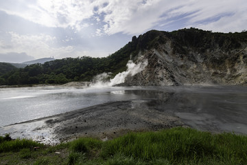 Smoke from large hot spring lake in Hokkaido Japan
