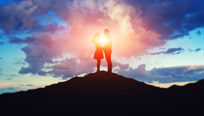 Silhouette of a loving couple at sunset