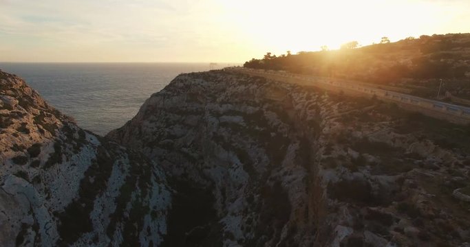 Aerial shot of European Maltese Cliffs during Sunset