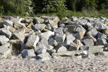 Stones protecting dunes against sea waves