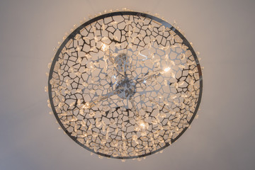 Ornate chandelier style ceiling light inside luxury apartment