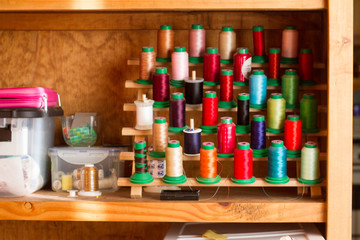 Machine Spools of assorted thread for sewing and quilting projects