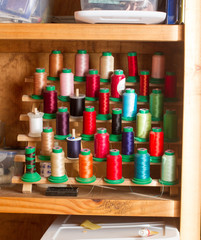 Fototapeta premium Machine Spools of assorted thread for sewing and quilting projects
