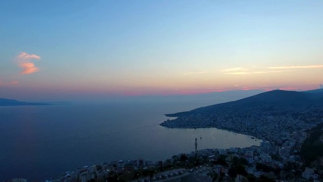 Aerial view Lekuresi Castle in Sarande or Saranda, Albania, Europe. Sundusk coastline and city Saranda.