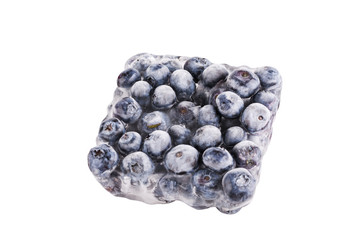Ice cube with blueberries isolated on white