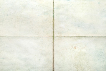 Old sheet of paper blank folded in four, texture background