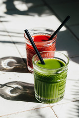 Red and green detox juice glass  with copy space.