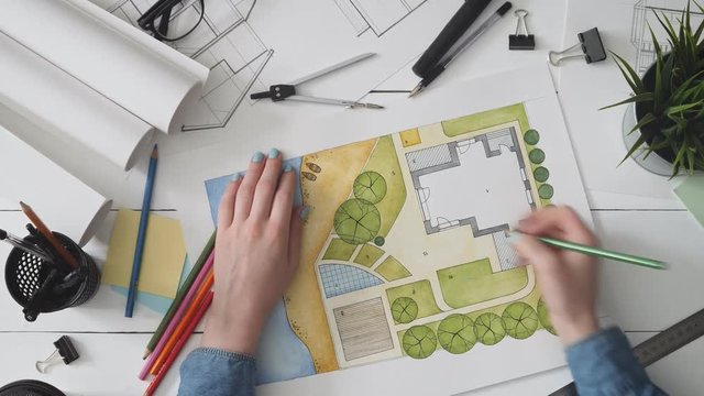 Landscape architect working on a garden design plan