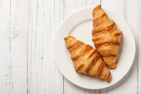 Fresh croissants on a plate