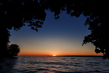 Fototapeta na wymiar Red sunset over the sea, river Volga