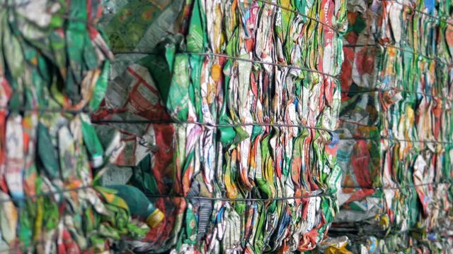 Coloured paper garbage packed into blocks and tied up