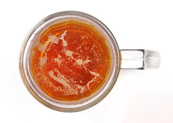 Mug of beer with bubble on glass isolated on white, top view