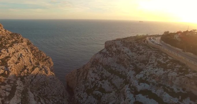 Aerial shot - Flying trough Cliffs during Sunset