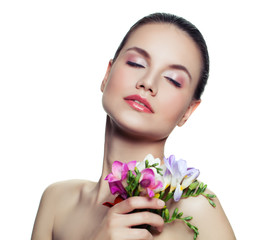 Young cute woman with colorful flower isolated on white background. Beautiful spa female model face. Facial treatment, cosmetology, skincare and spa concept