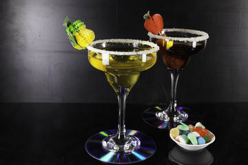 Red and yellow cocktails and coasters