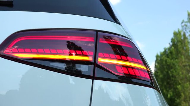 Closeup on a blinking rear LED light of a car