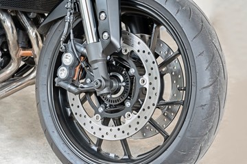 Close up of front radial mount caliper on big bike, Motorcycle with Twin Floating Disk Brake and ABS system on a Sport Bike with copy space.