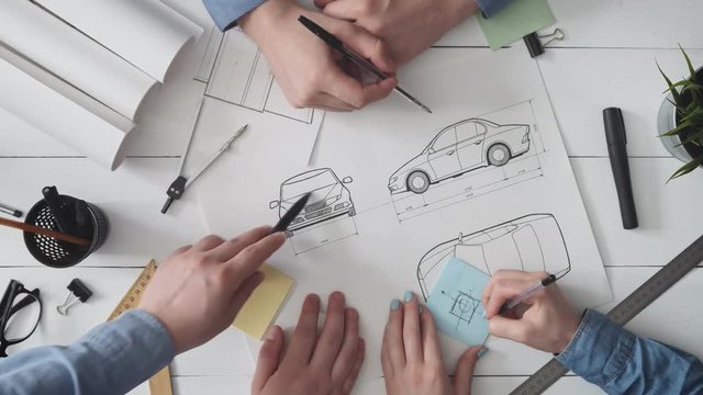 Engineering team working on a new automobile design