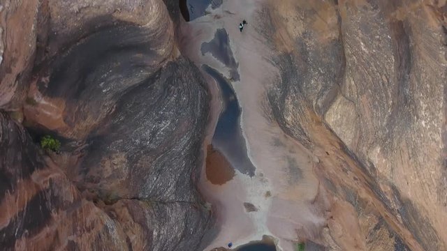 Aerial looking straight down over a red rock steep canyon