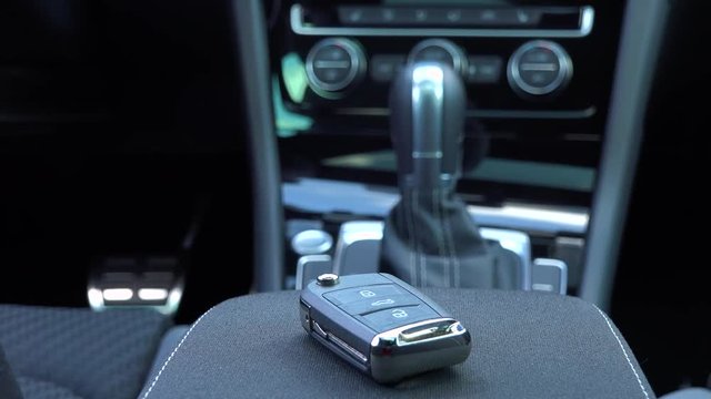 Closeup on a remote control key in a car