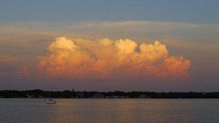 Naklejka na ściany i meble Storm cloud during sunset in Seminole, Florida...