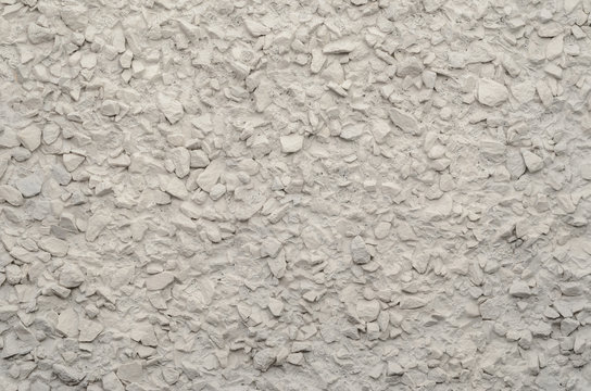 Painted Pebble Plaster Wall Texture. Fine Gravel in the Finish of the Wall