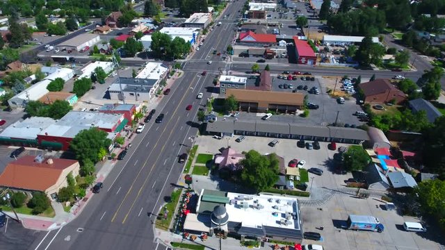 Aerial over colorful small town intersection 