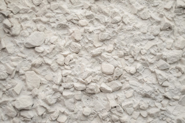 Painted Pebble Plaster Wall Texture. Fine Gravel in the Finish of the Wall