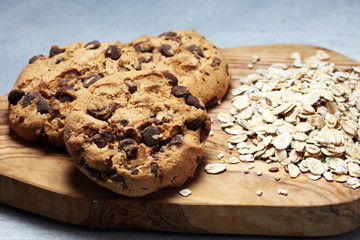 Chocolate cookies on rustic table. Chocolate chip cookies and cookies with oat flakes or oatmeal.