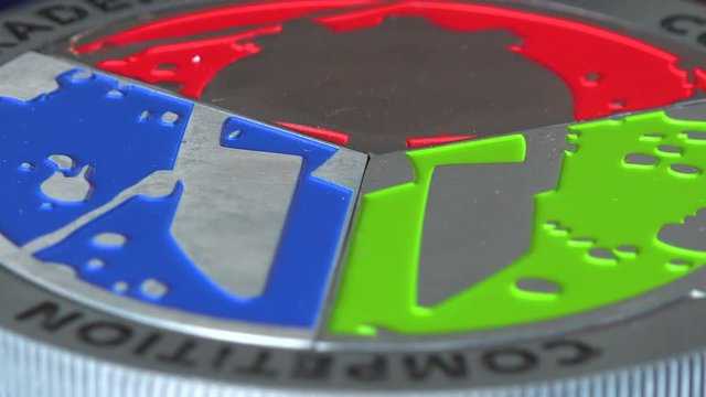 Closeup on a medal from a Spartan dirty race on a table