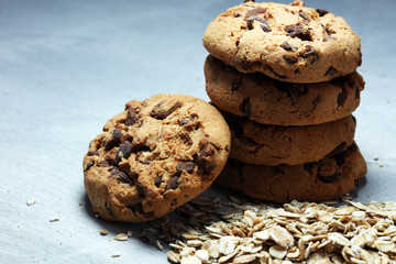 Chocolate cookies on rustic table. Chocolate chip cookies and cookies with oat flakes or oatmeal.