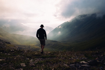 Man hiking down a mountain