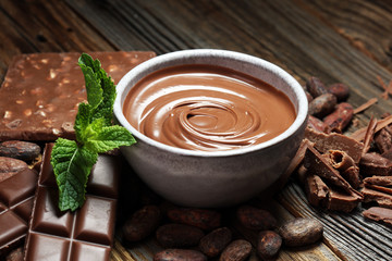 Melting chocolate  or melted chocolate with a chocolate swirl. Many stack and chips with powder.
