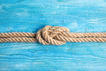 Fototapeta premium Rope, knot and background wood