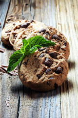 Chocolate cookies on rustic table. Chocolate chip cookies shot.