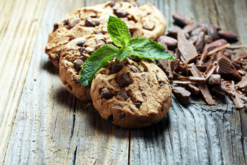 Chocolate cookies on rustic table. Chocolate chip cookies shot.