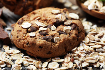 Chocolate cookies on rustic table. Chocolate chip cookies and cookies with oat flakes or oatmeal.