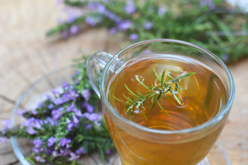 Cup of  fresh natural tea on wooden table.  Thymus serpyllum natural tea, Breckland Thyme  with cup...