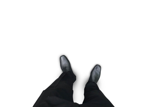 Isolated businessman in black shoes standing on white floor