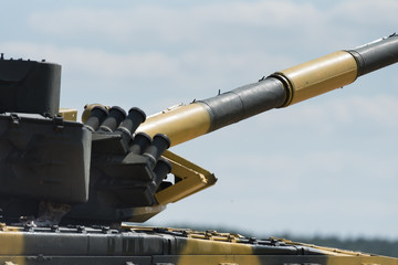 Military or army tank ready to attack and moving over a deserted battle field terrain. a lot of...