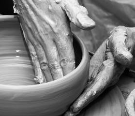 Process of making clay bowl on pottery wheel