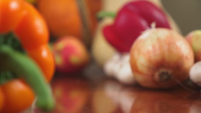 Autumnal Harvest or Thanksgiving, Cornucopia filled with vegetables, vegetables spilled out of the basket on the table. 4k, dolly shot