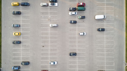 Empty parking lots, top view. Aerial view of a car parked alone in a parking, free lots