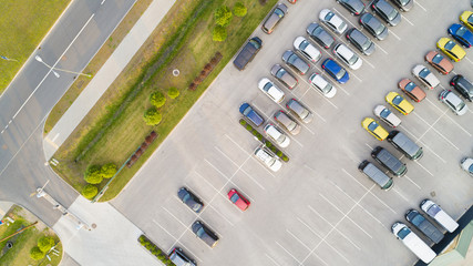 Parking lots, top view. Aerial view of a colorful cars parked in a parking.