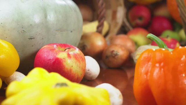 Autumnal Harvest or Thanksgiving, Cornucopia filled with vegetables, vegetables spilled out of the basket on the table. 4k, dolly shot