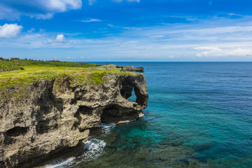 Fototapeta na wymiar Famous Place in Japan, Manzamo Cape with blue sky and beautiful sea in Okinawa, Japan, copy space