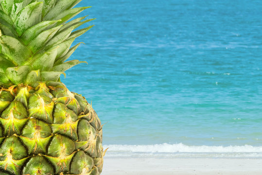 Pineapple with sea backdrop, summer theme