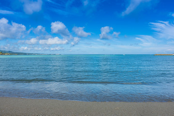 Sand Beach and sea for relaxation on holiday, Scenic view of sea with blue sky, Travel destination, nature sea view with sand beach, nature background, Tropical beach and Trquoise water in summer