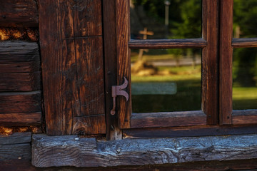 Window in an old wooden house, Europe, Poland.