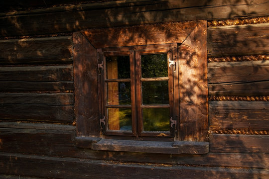 Window in an old wooden house, Europe, Poland.